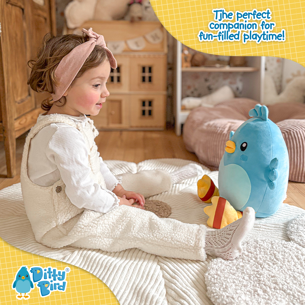 A young child sits on a cozy rug in a playroom, smiling at the NEW! Ditty Bird Squishy Soft Plush from Ditty Bird—the ultimate huggable companion for joyful playtime, surrounded by wooden furniture and a toy house.