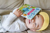 Baby is enjoying interactive musical book